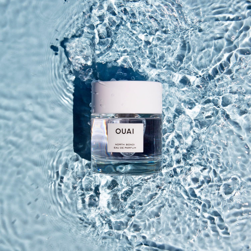 OUAI North Bondi bottle beside neck hints at total-body fragrance use.