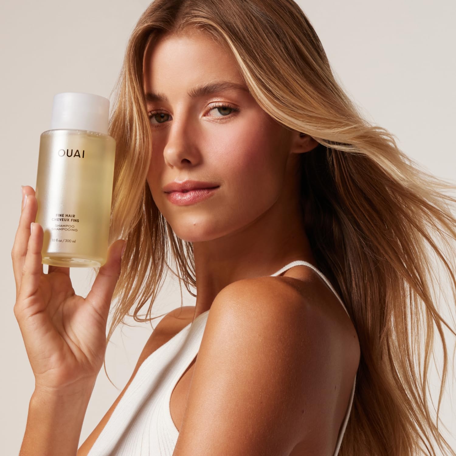OUAI shampoo lather close-up highlights light foam cleansing feel