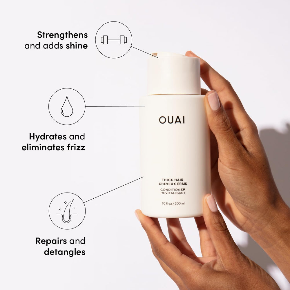 OUAI shampoo lather in hand demonstrates gentle cleansing for thick hair.
