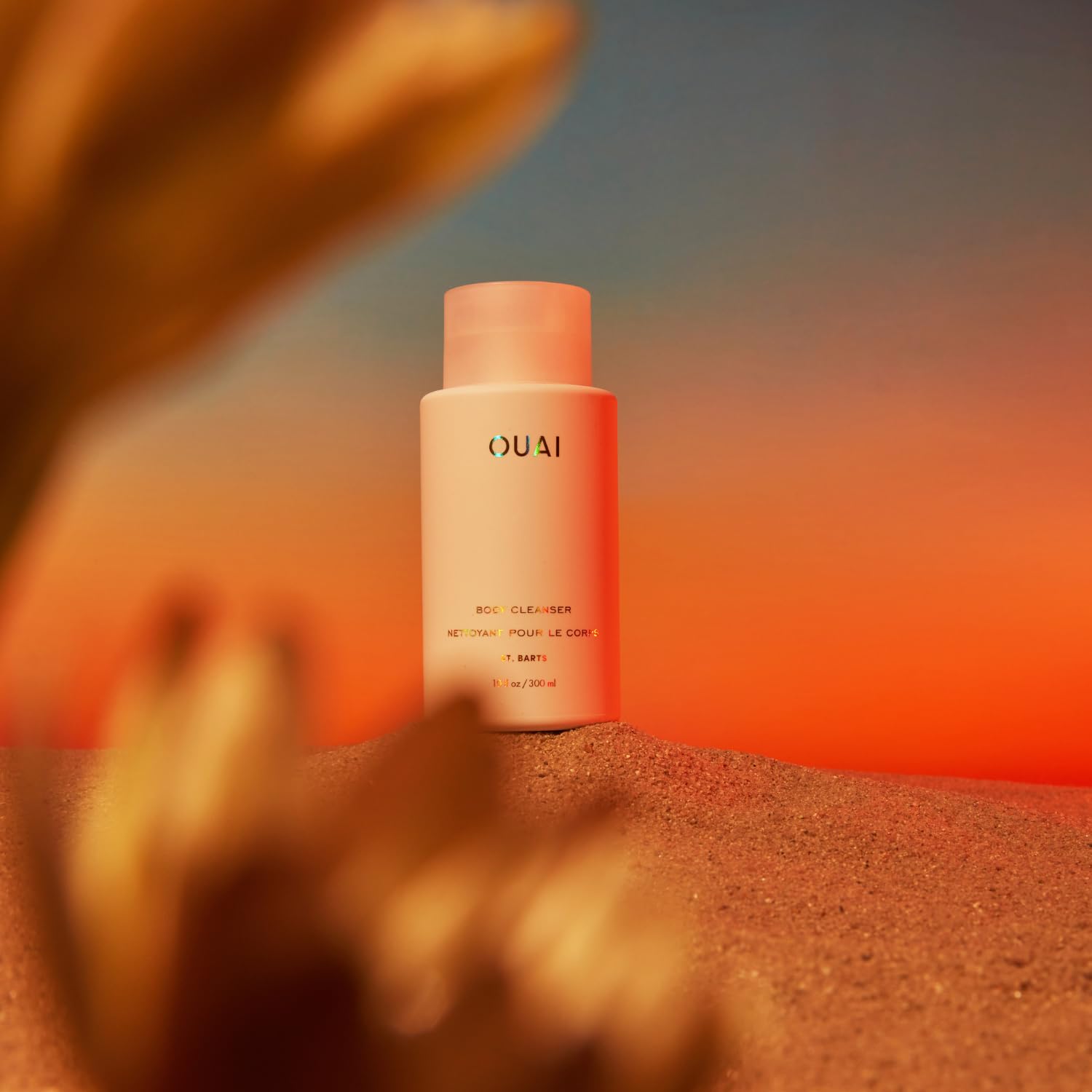 OUAI St. Barts rosehip oil application highlighting antioxidant-rich nourishment.