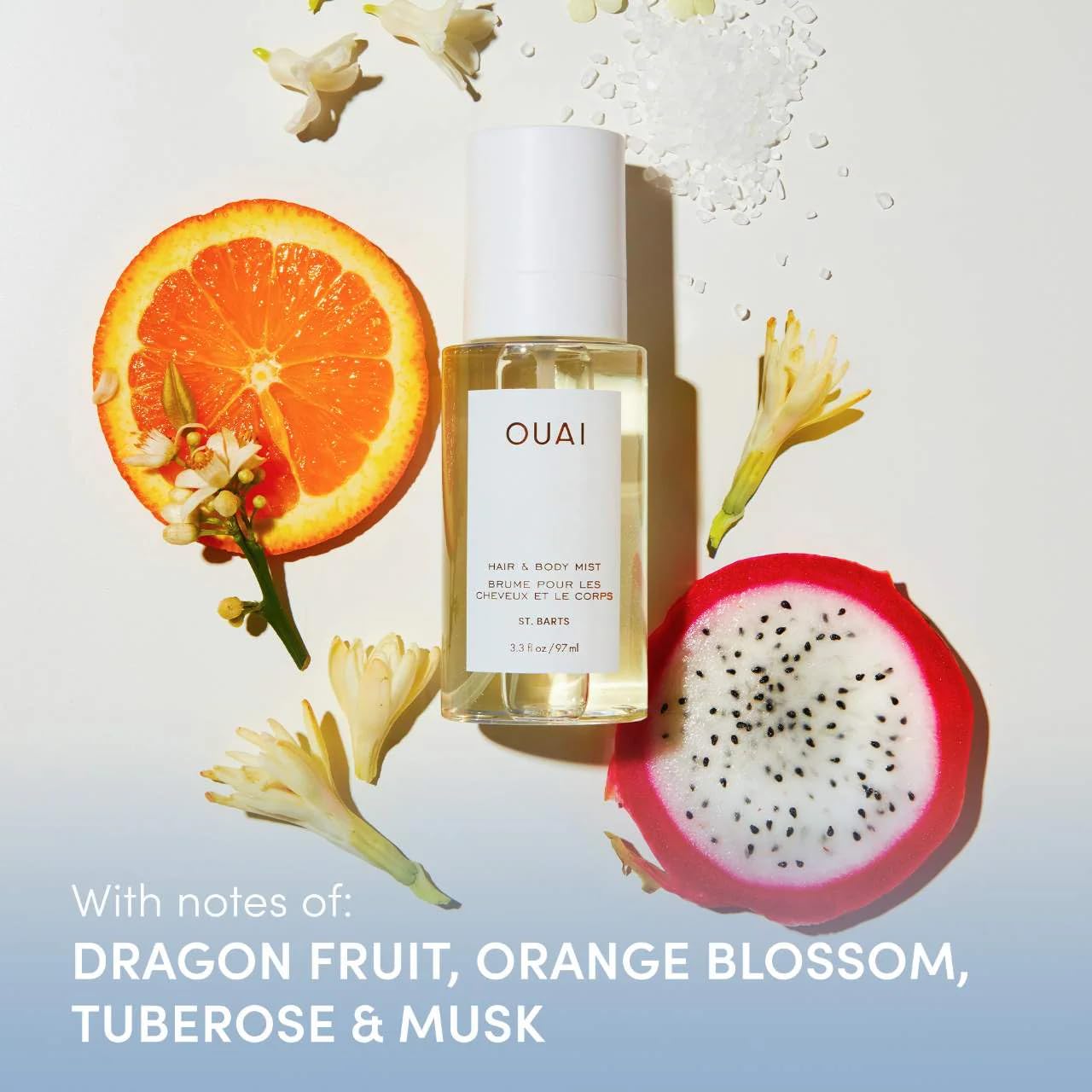 OUAI St. Barts spray being applied to hair for a refreshing touch