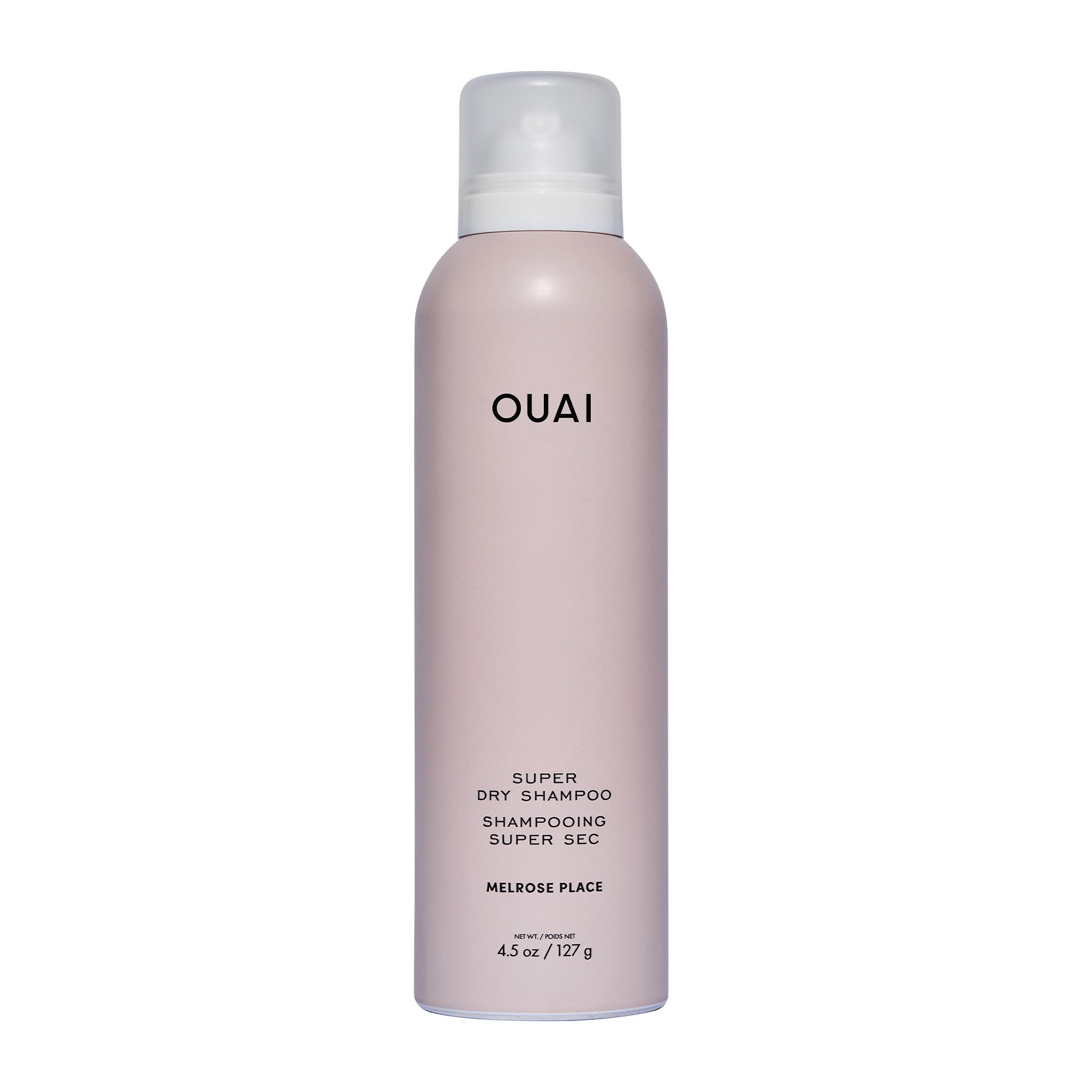 OUAI Super Dry Shampoo spray can at distance demonstrates oil absorption from roots