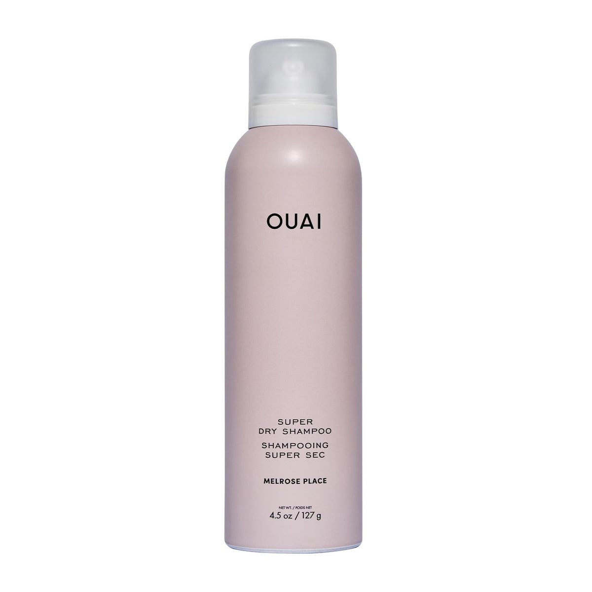 OUAI Super Dry Shampoo spray can at distance demonstrates oil absorption from roots