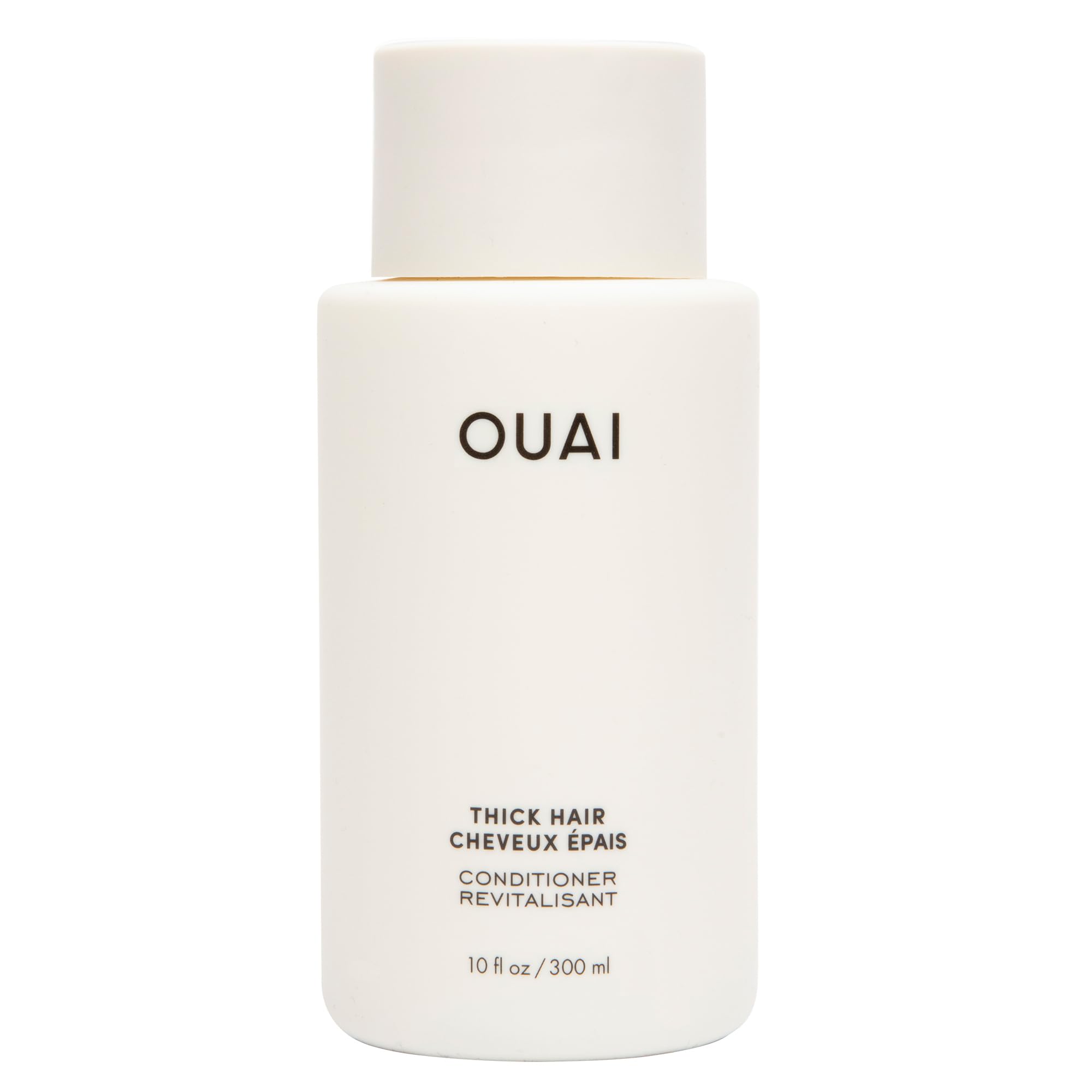 OUAI Thick Hair Conditioner bottle pouring for detangling and frizz control.