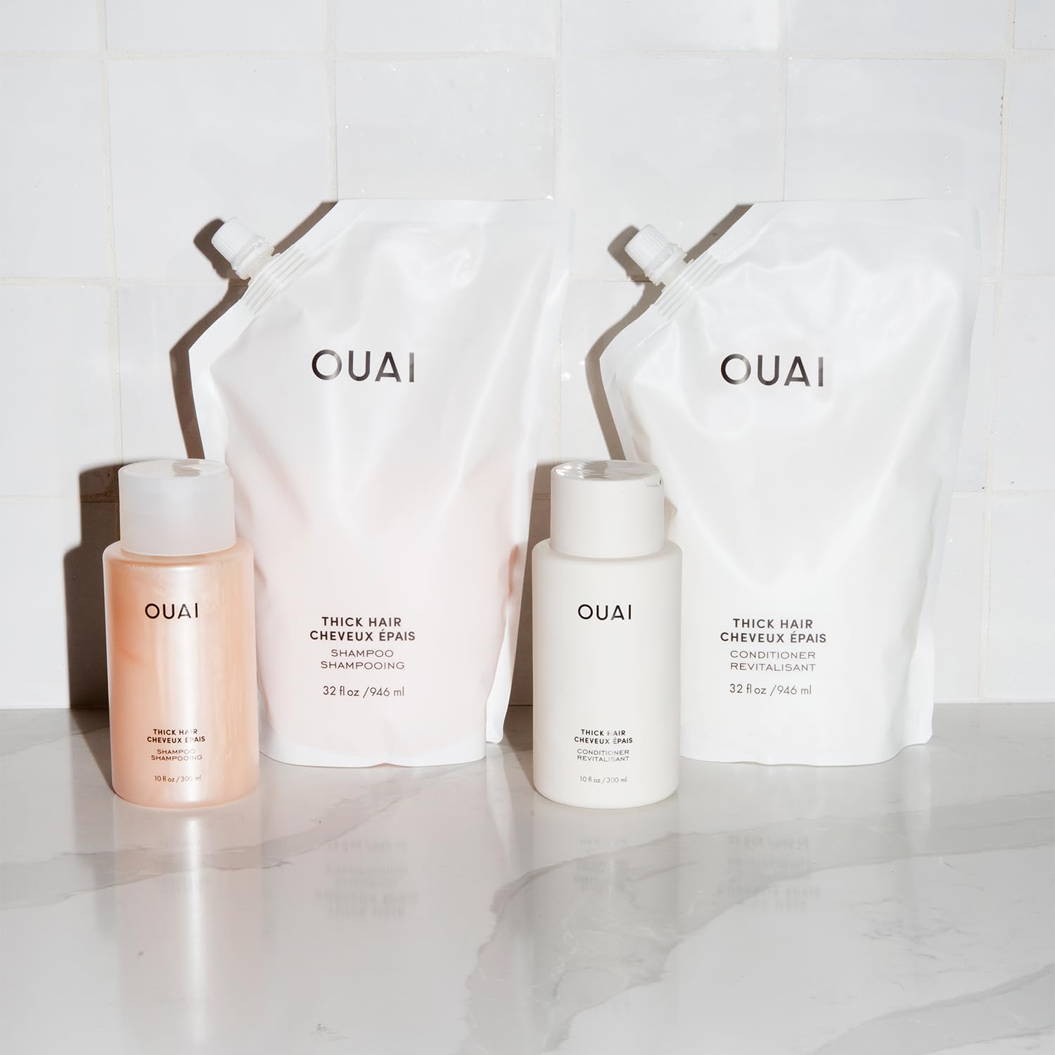 OUAI Thick Hair Conditioner in shower ready for mid-length to ends nourishment