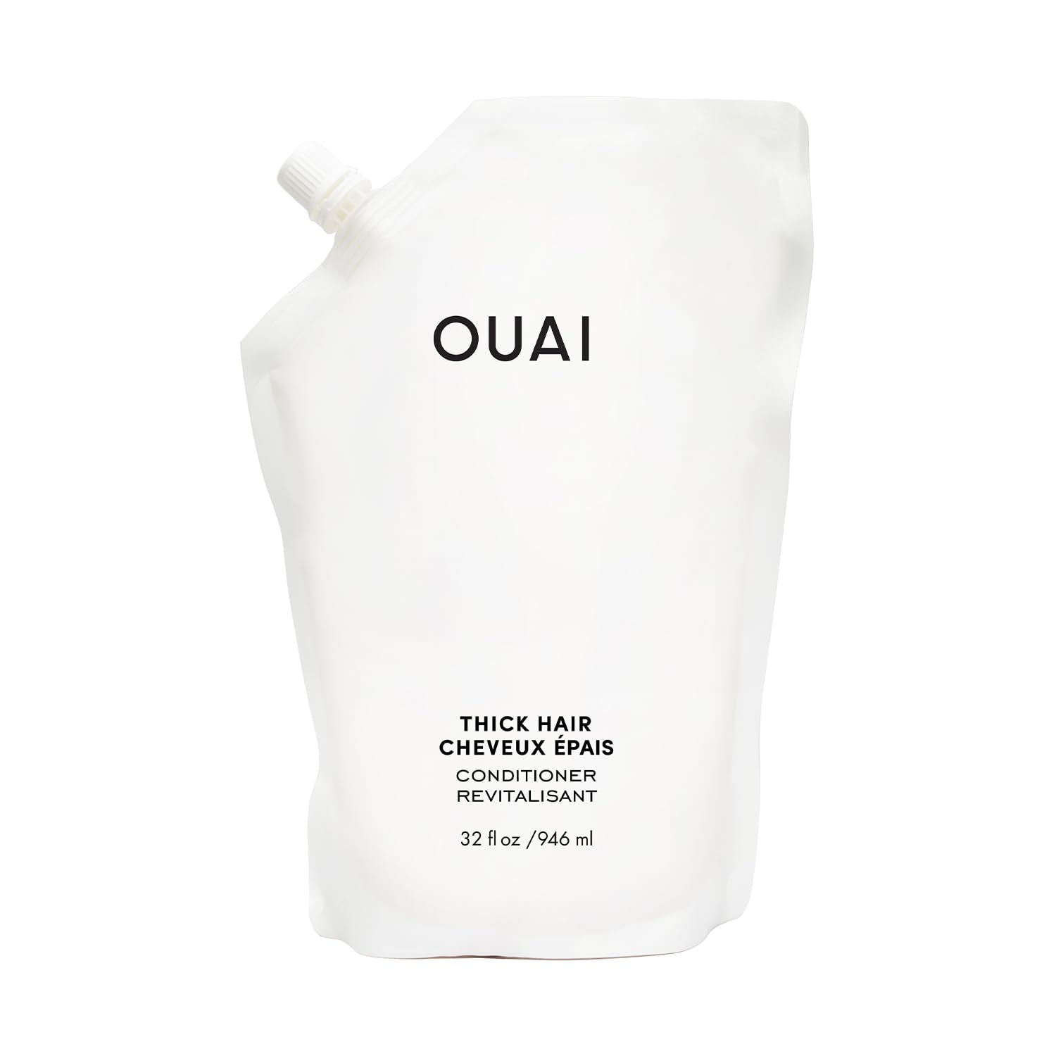 OUAI Thick Hair Conditioner refill bottle closeup highlighting hydrating formula for strands