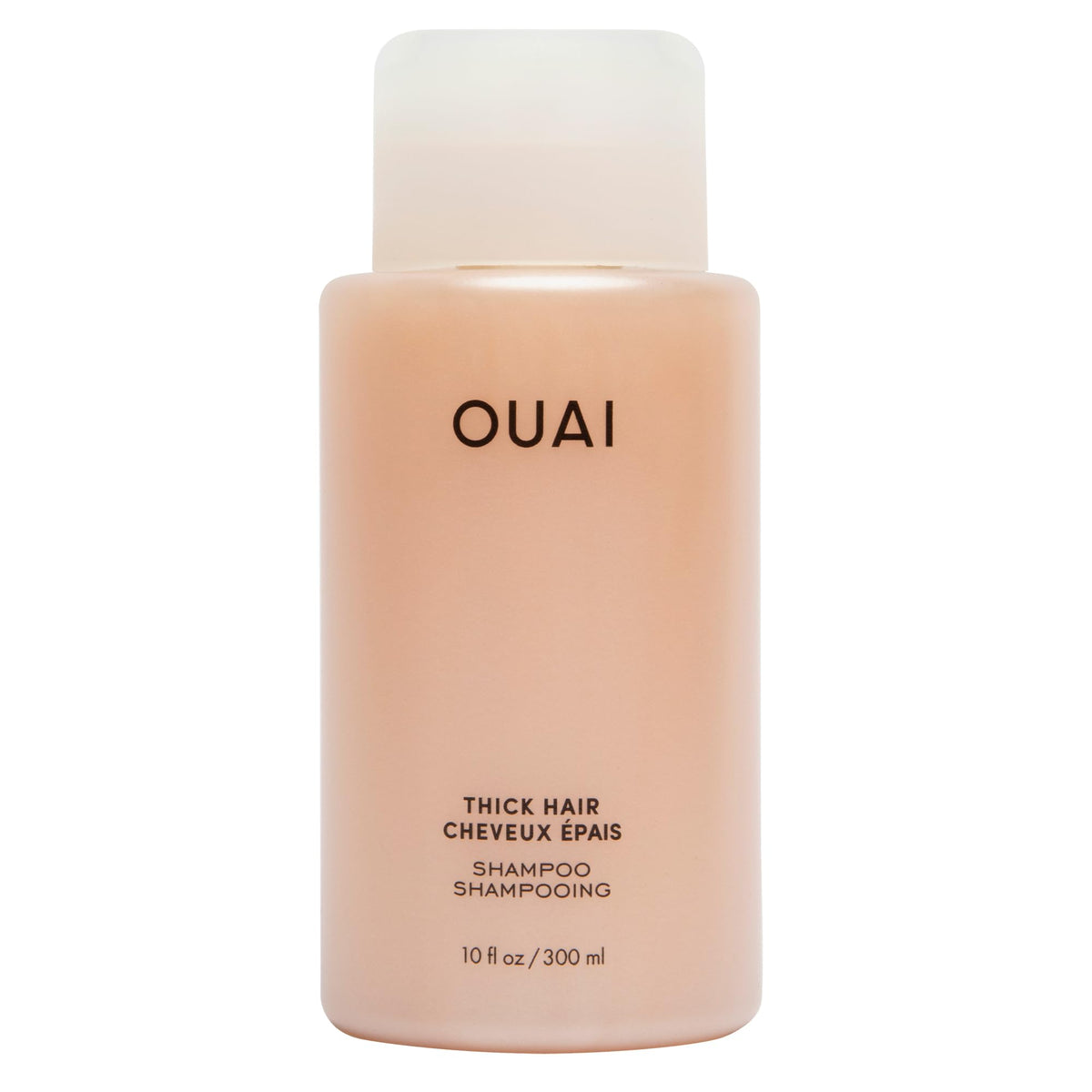 OUAI Thick Shampoo bottle close-up highlighting hydration and frizz control.