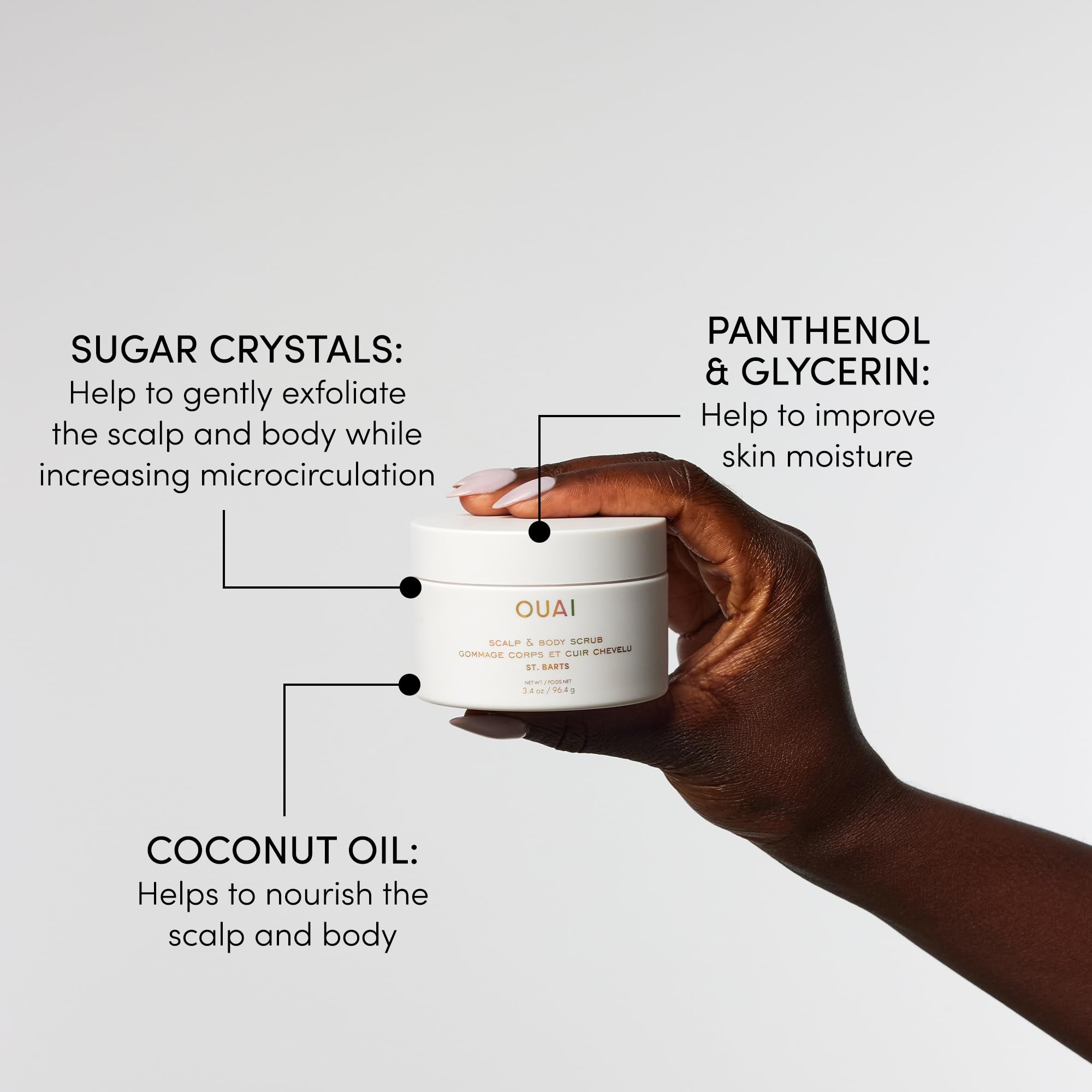 OUAI travel-size bottle close-up emphasizes compact packaging for on-the-go routines.