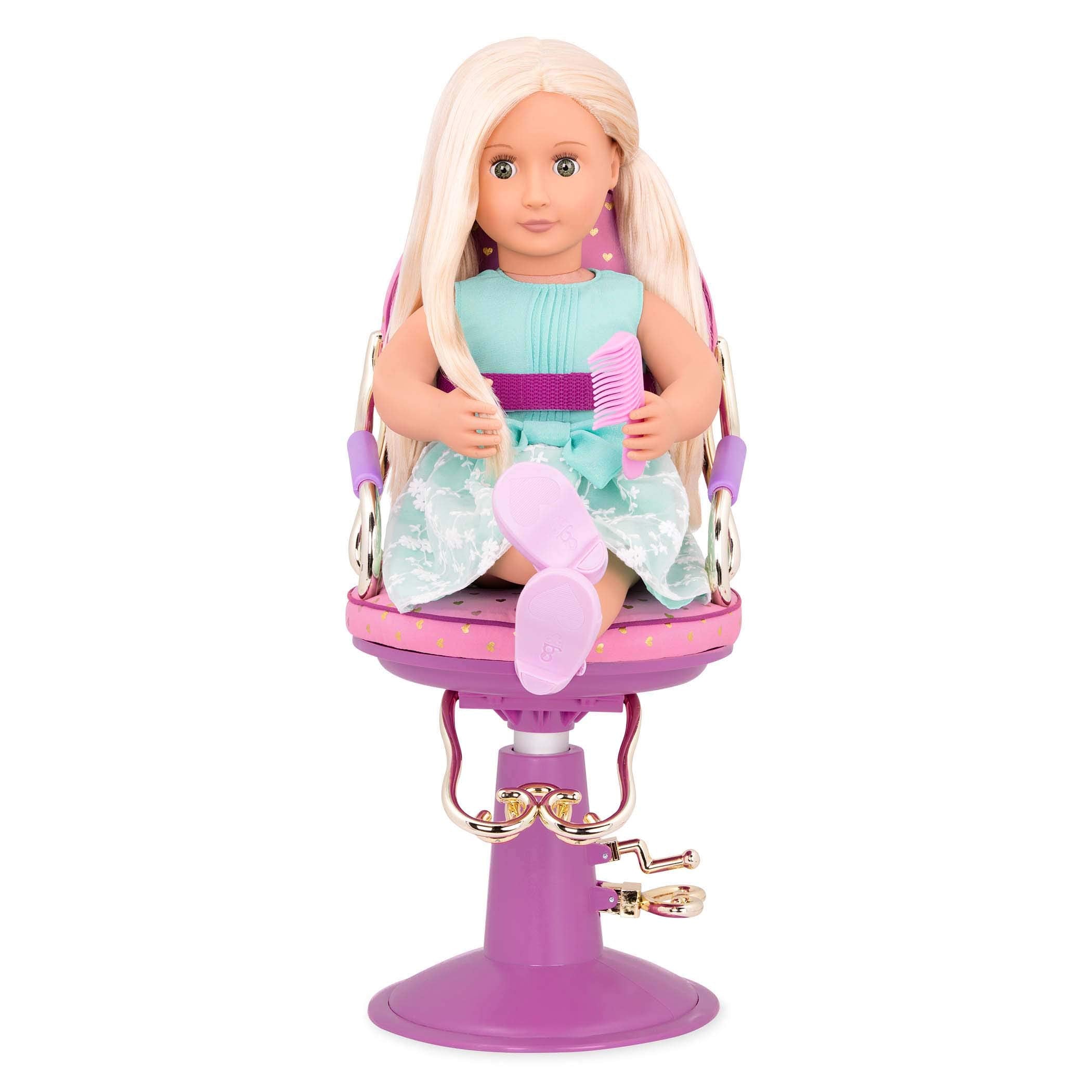 Our Generation hair-dryer accessory from the set adds authentic styling play.