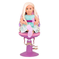 Our Generation hair-dryer accessory from the set adds authentic styling play.