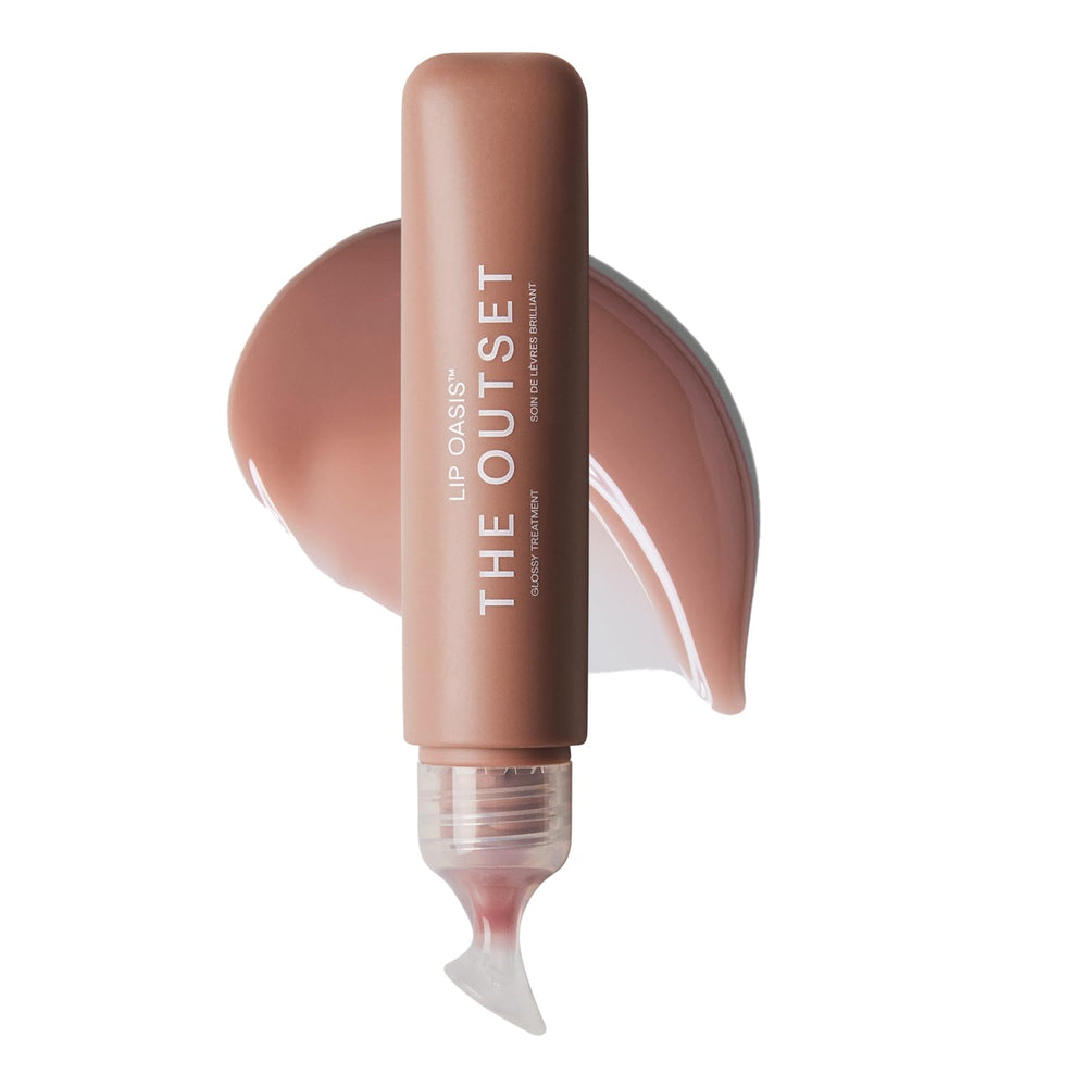 The Outset Lip Oasis Glossy Treatment Dune bottle demonstrates long-lasting hydration.
