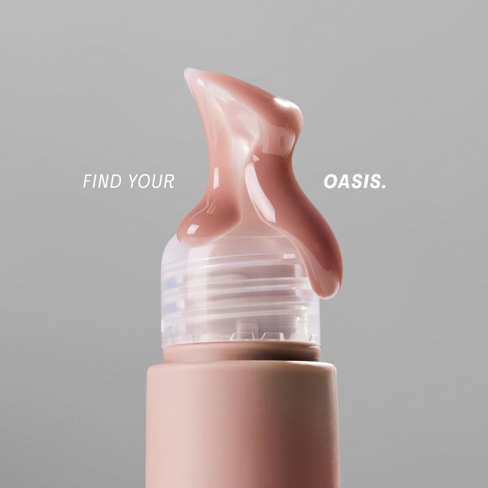 The Outset Lip Oasis Glossy Treatment gloss shine detail captures lasting luminosity on lips.