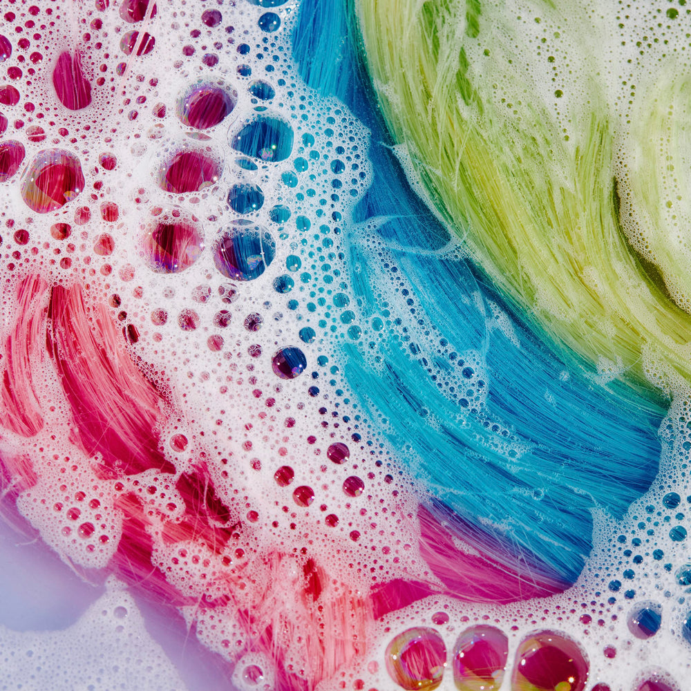 oVertone The Fader Clarifying Shampoo lather showcases sulfate-free cleansing that hydrates and removes buildup.