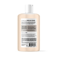 oVertone The Fader Clarifying Shampoo pouring action demonstrates gentle color lift without harsh chemicals.