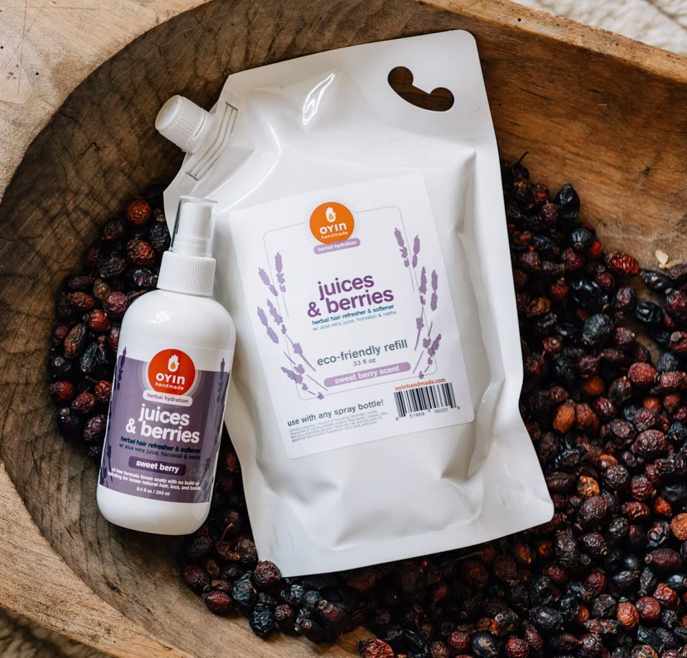 Oyin Handmade Juices & Berries tonic bottle pour showing easy application for detangling and moisture