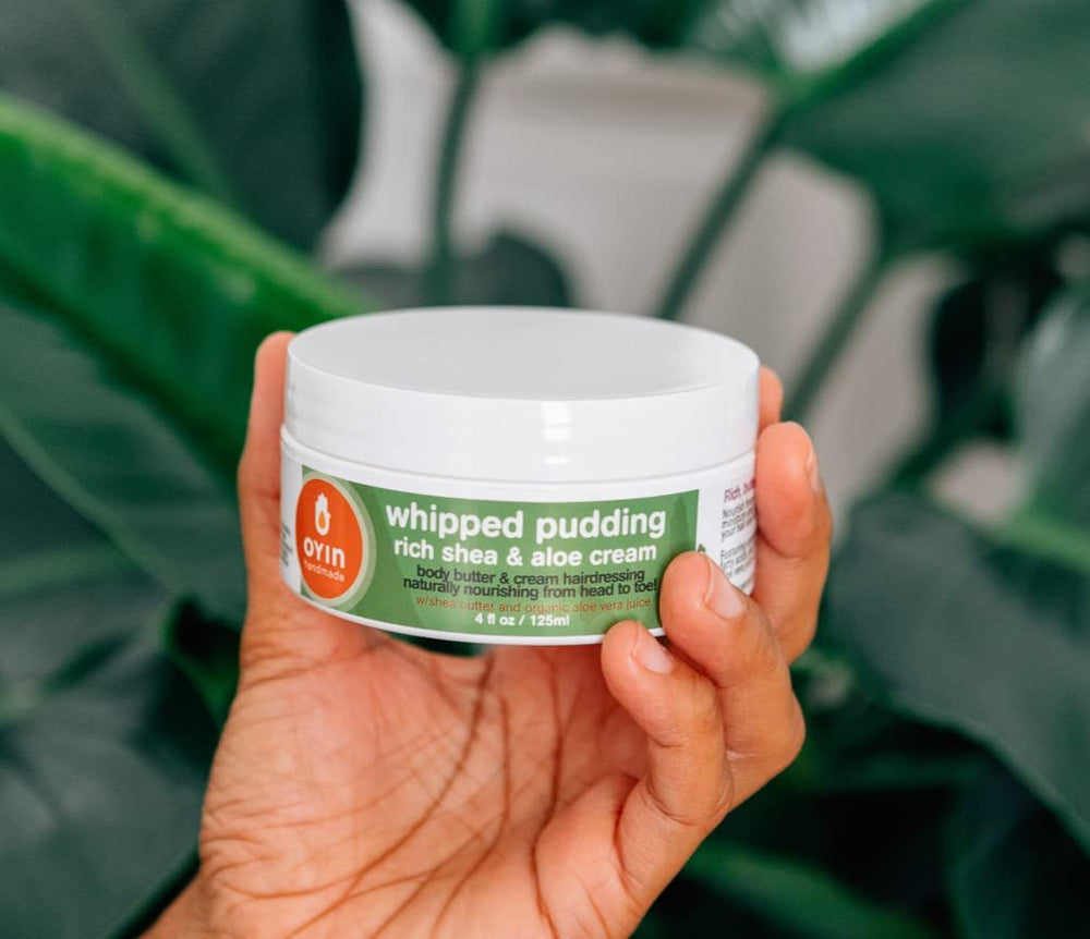 Oyin Handmade Whipped Pudding being applied to hair for pre-shampoo conditioning.