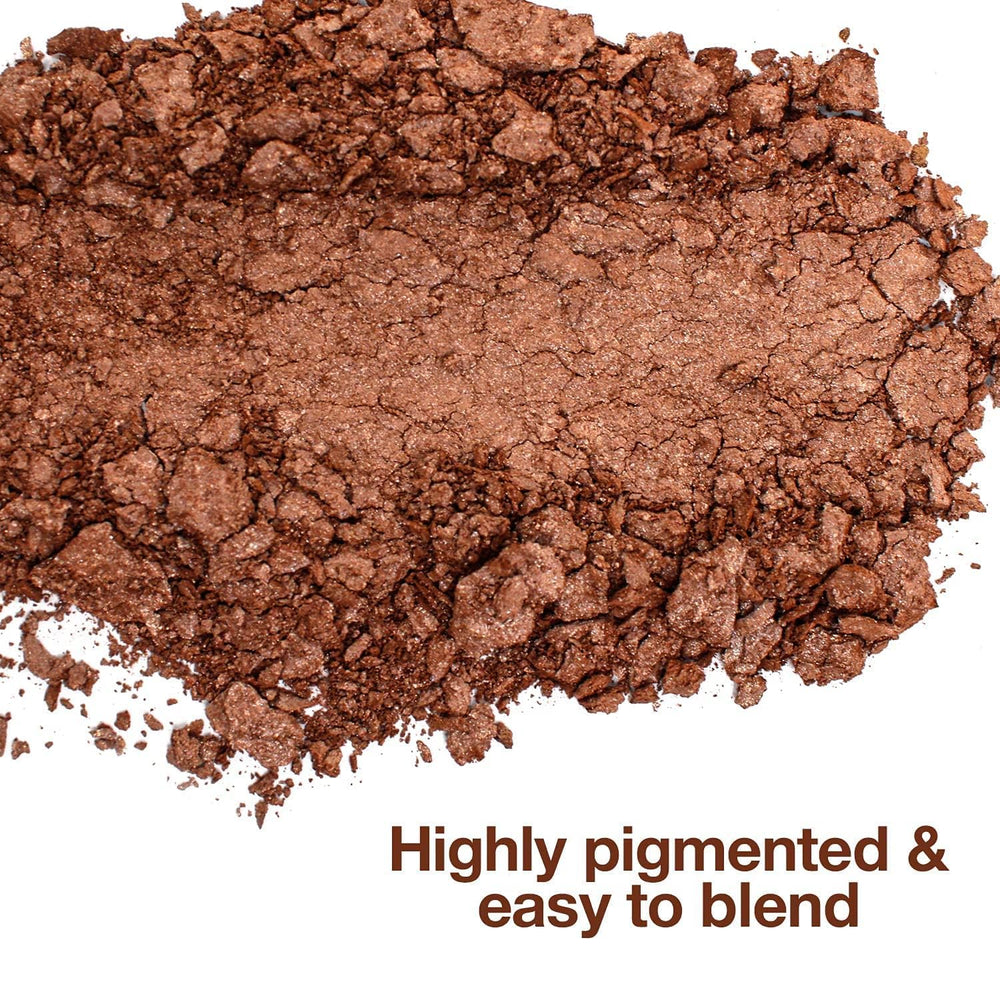 Palladio Baked Bronzer with brush swirl demonstrates easy blending for natural warmth.