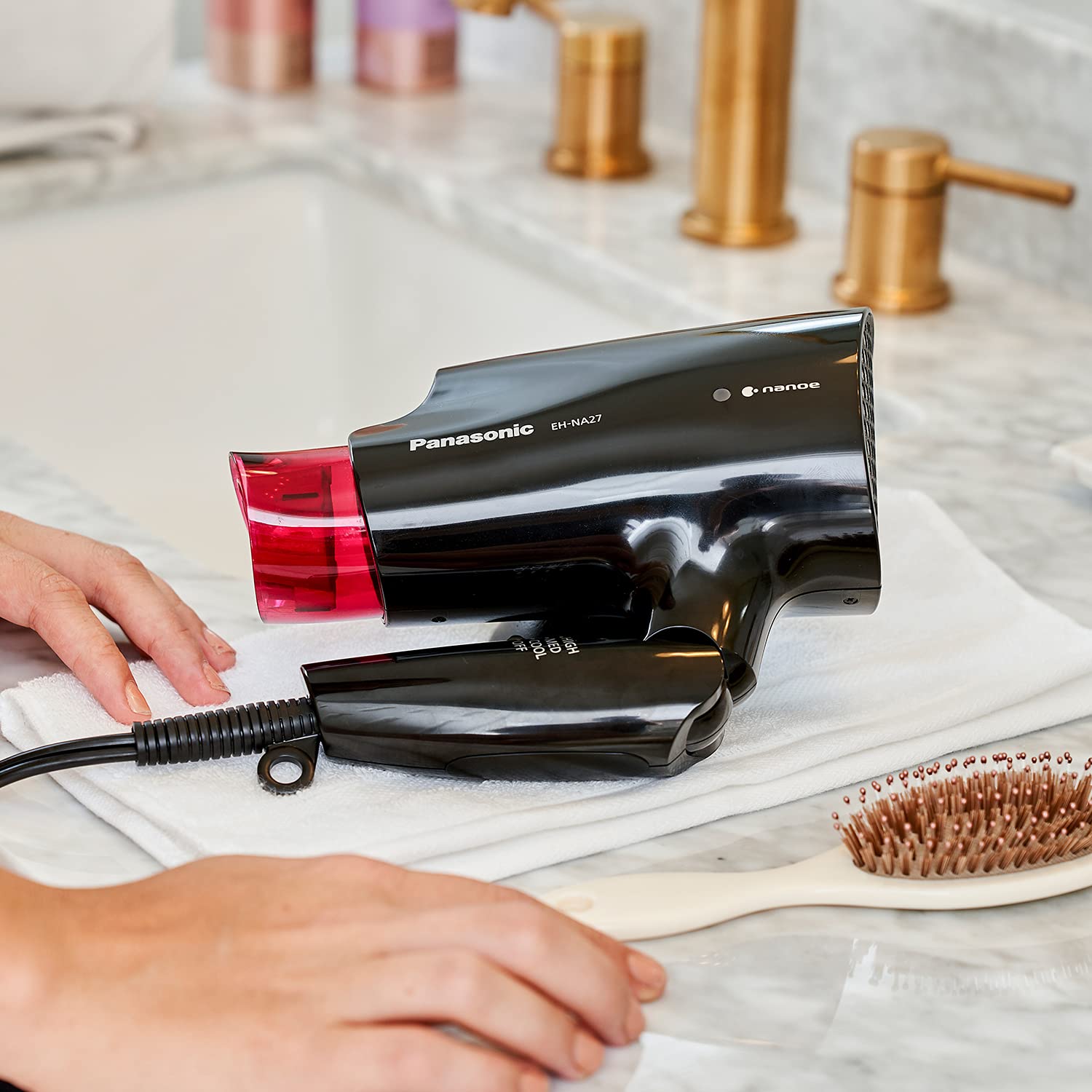 Panasonic travel-friendly dryer shown ready for gym bag or suitcase.