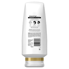 Pantene Pro-V Curl Perfection Conditioner application on hair for smoother, bouncier curls.