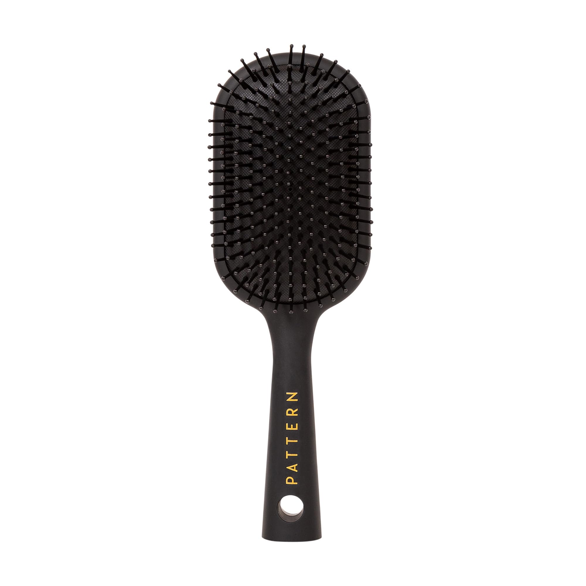 PATTERN Beauty paddle brush heat-resistant bristles for smoother detangling and styling.