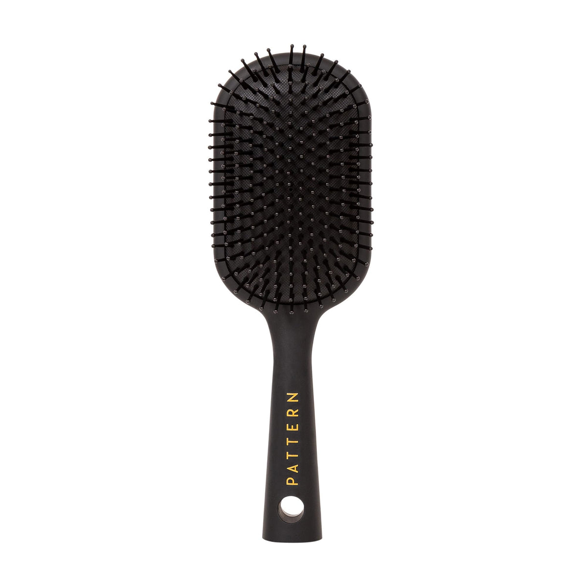 PATTERN Beauty paddle brush heat-resistant bristles for smoother detangling and styling.