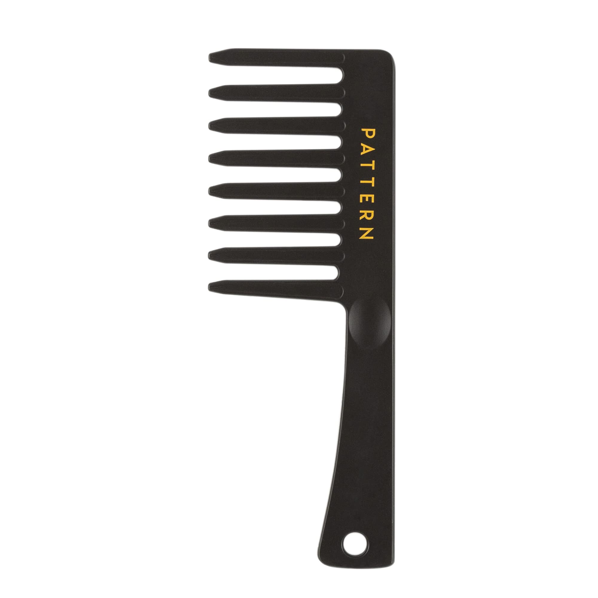 PATTERN Beauty wide-tooth comb closeup for gentle detangling and curl definition.