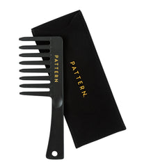 PATTERN Beauty wide-tooth comb in use on curls providing smooth detangling.