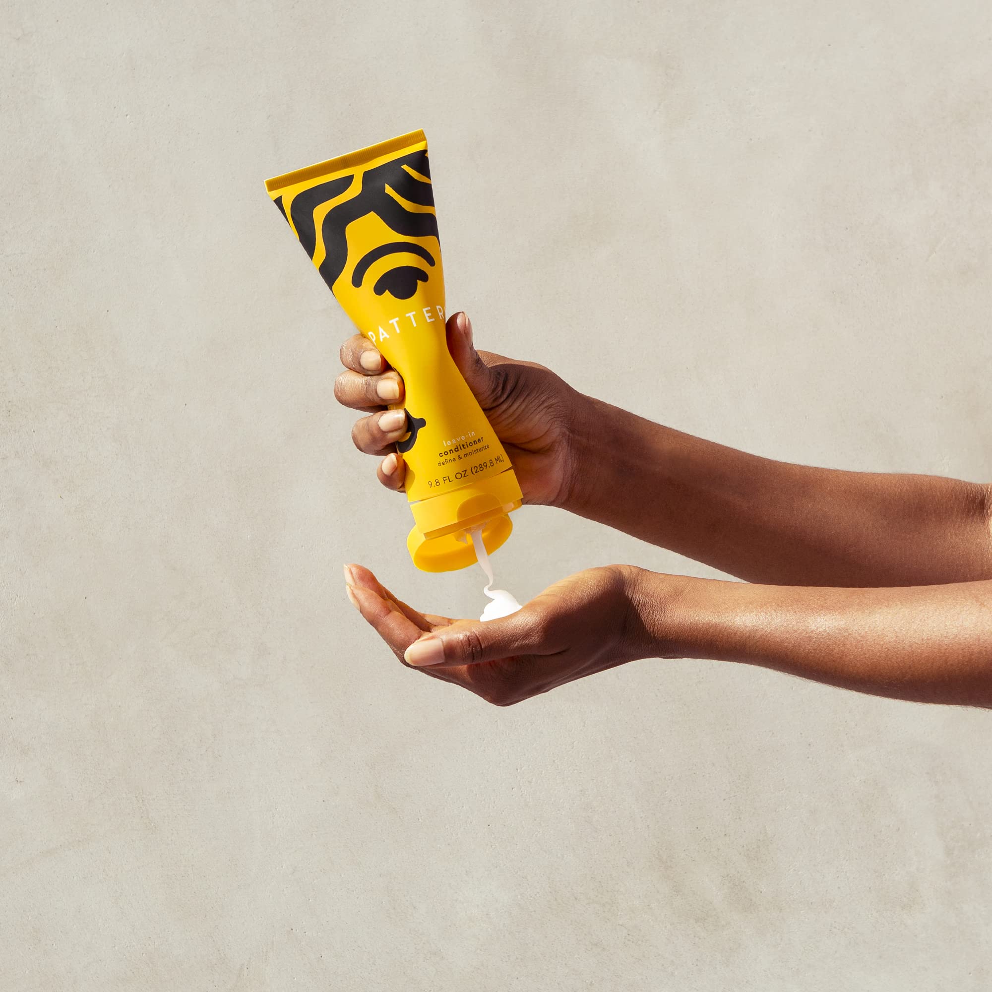 PATTERN Leave-In Conditioner on wet curls supports smooth detangling and definition.