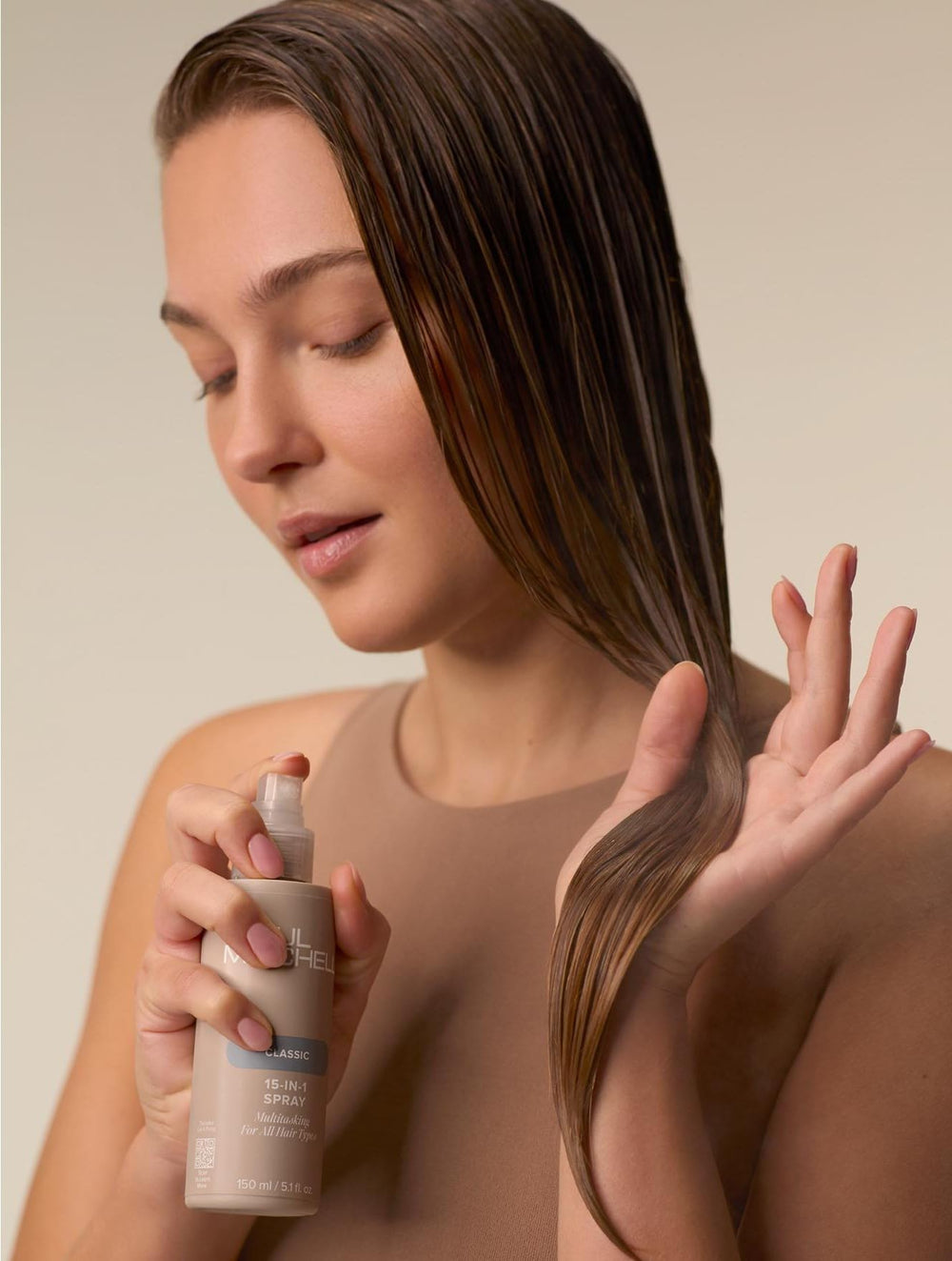 Paul Mitchell 15-In-1 Spray in action for quick on-the-go application