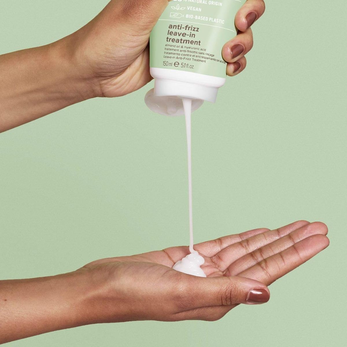Paul Mitchell Clean Beauty anti-frizz leave-in pump highlights easy application and frizz control.