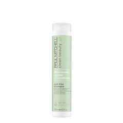 Paul Mitchell Clean Beauty anti-frizz shampoo bottle pour promotes frizz control for textured hair.