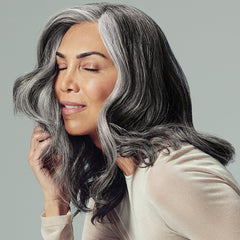 Paul Mitchell Extra-Body Finishing Spray mist demonstrating flexible hold and shine.