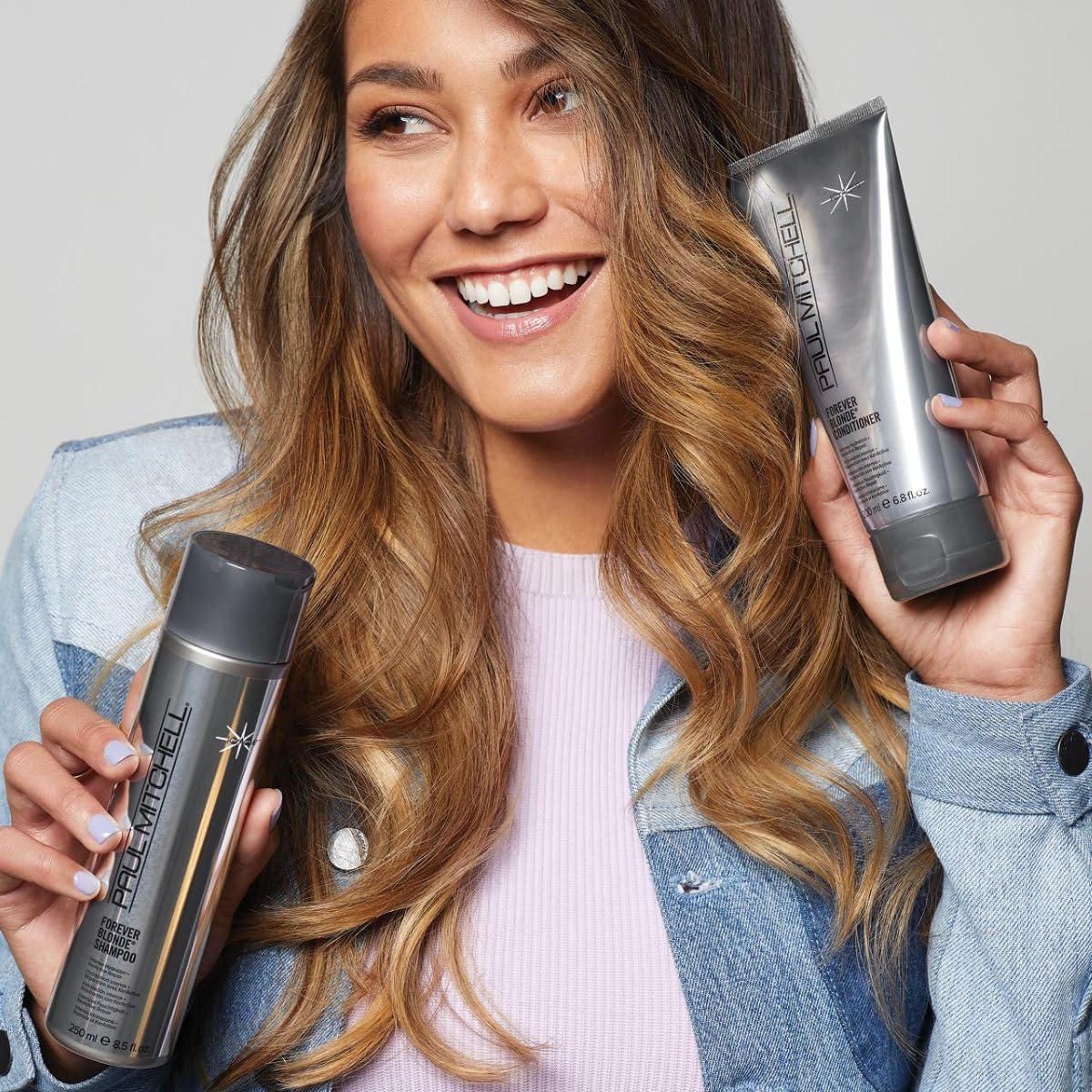 KerActive protein label on Paul Mitchell Forever Blonde packaging signals elasticity support.