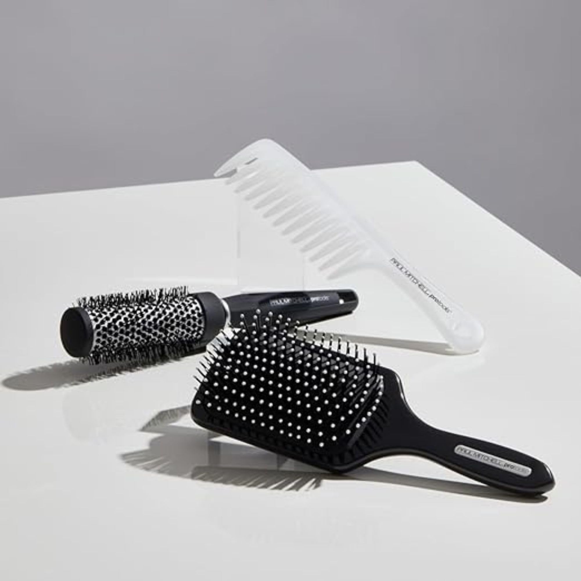 Paul Mitchell Pro Tools 427 Paddle Brush designed for long hair blowouts and volume.