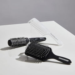 Paul Mitchell Pro Tools 427 Paddle Brush designed for long hair blowouts and volume.