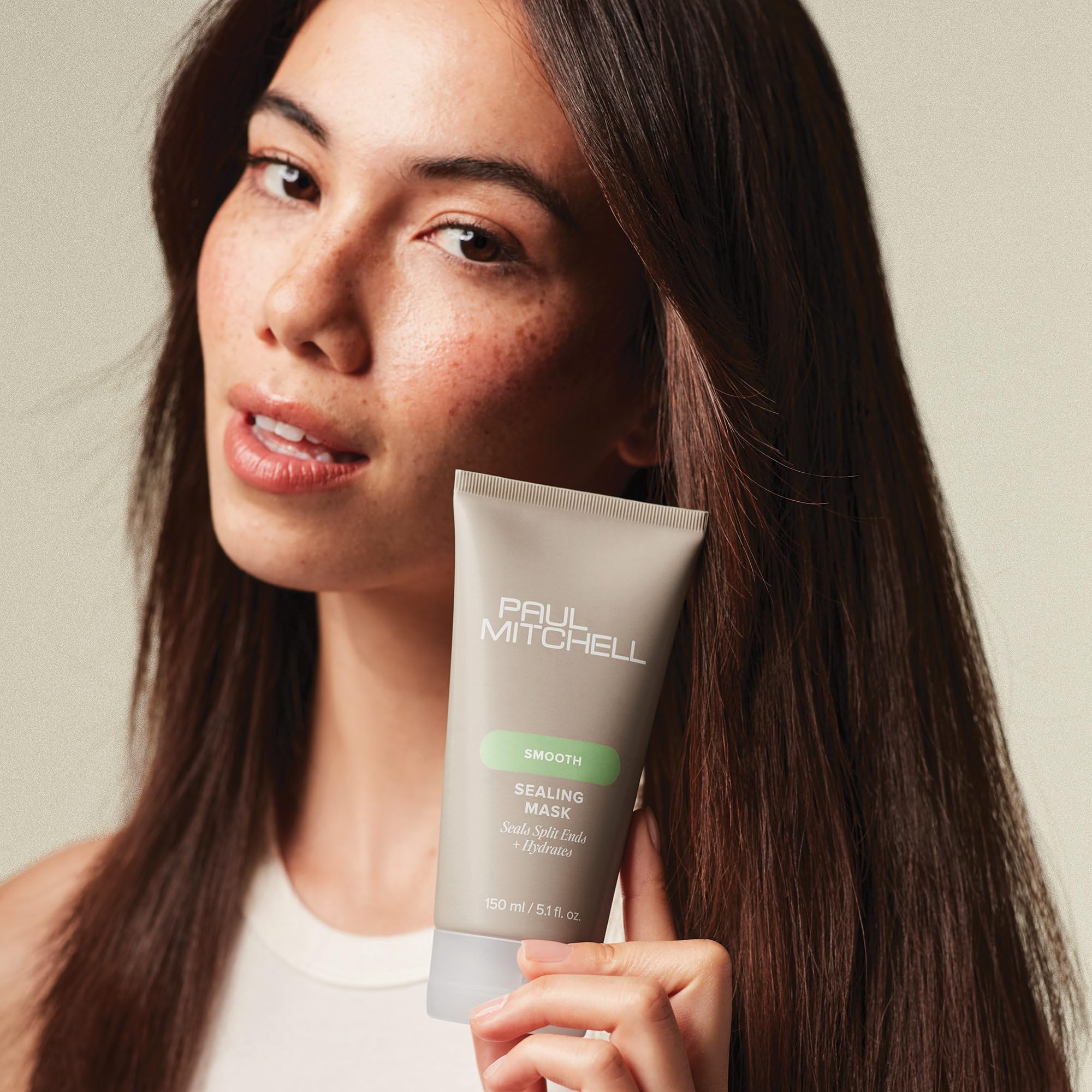 Paul Mitchell Sealing Mask hair application — smooths frizz during daily styling.
