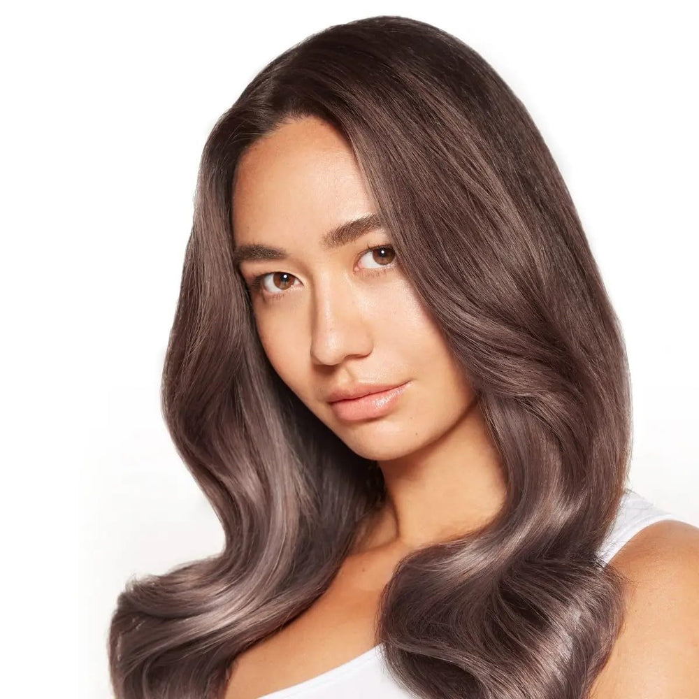 Paul Mitchell Super Skinny Serum wet application highlights easy distribution through damp hair.