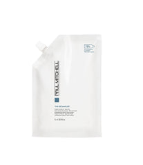 Paul Mitchell The Detangler bottle pour showcases easy detangling and smooth, manageable hair.
