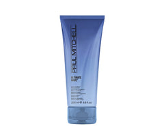 Paul Mitchell Ultimate Wave bottle closeup shows lightweight, humidity-resistant hold for textured waves.