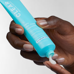 Paula's Choice CLEAR cream texture close-up shows lightweight matte finish.