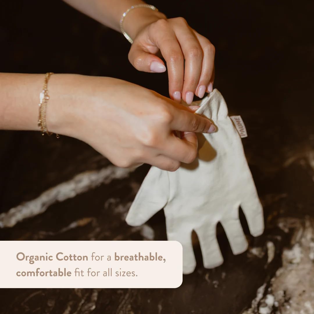 PAUME Overnight Hydration Gloves on hand by bed, promoting overnight moisture.