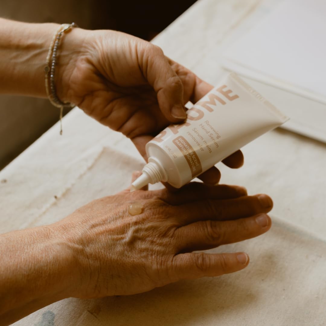 PAUME Renewing Hand Serum being massaged into hands for moisture