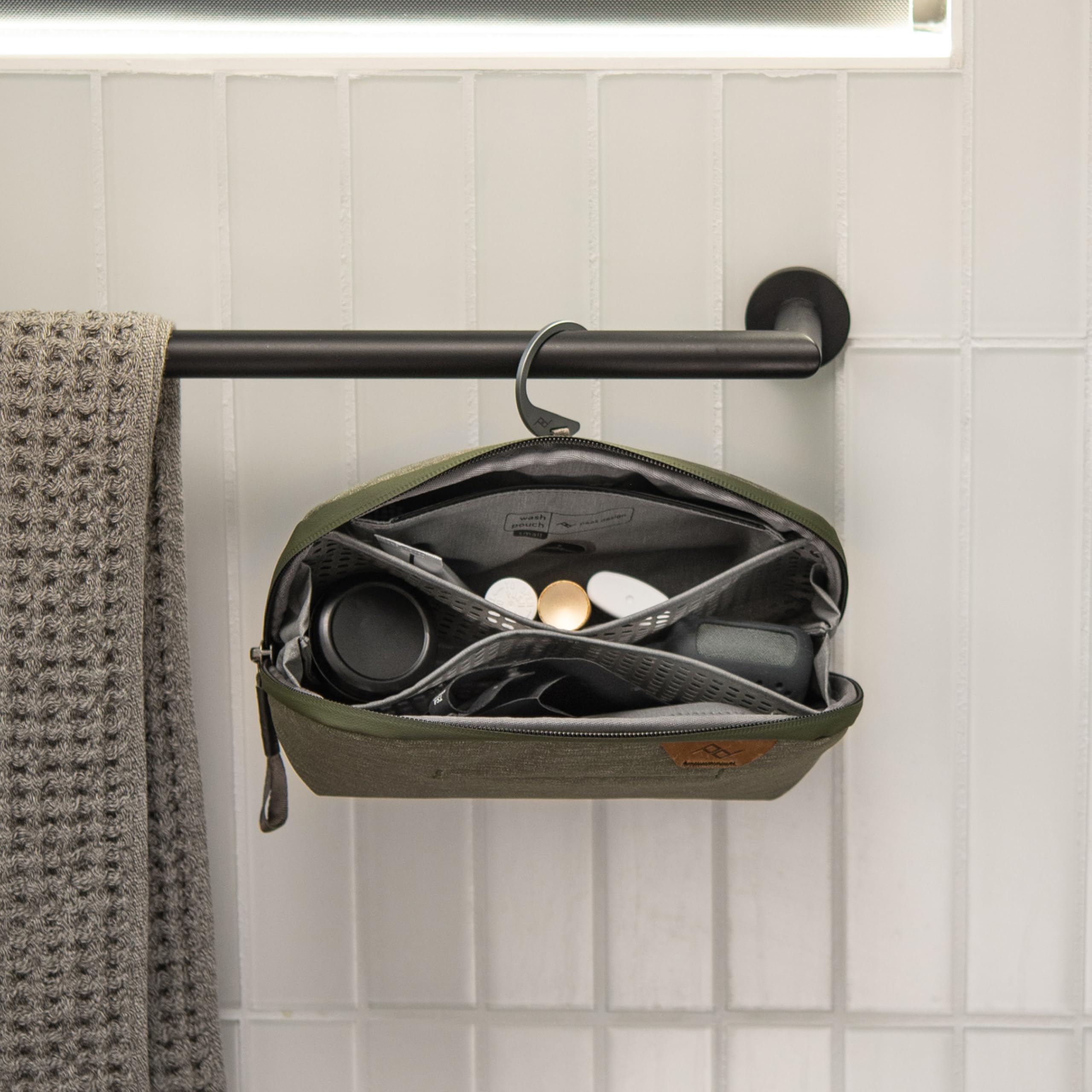 Peak Design Small Wash Pouch Sage hanging setup shows convenient counter or hook use