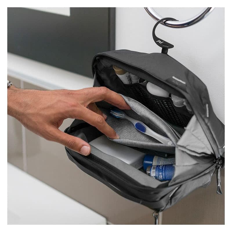 Peak Design Wash Pouch hangs with a stowable hook for space-saving travel organization.