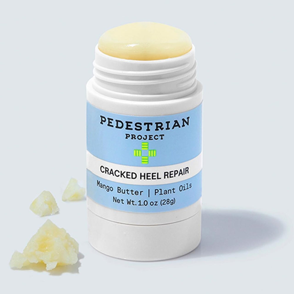 Pedestrian Project heel balm applying to a rough heel in soft, hydrated finish