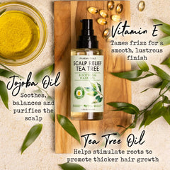 PHARM TO TABLE Tea Tree Hair Oil bottle on dry hair for frizz control
