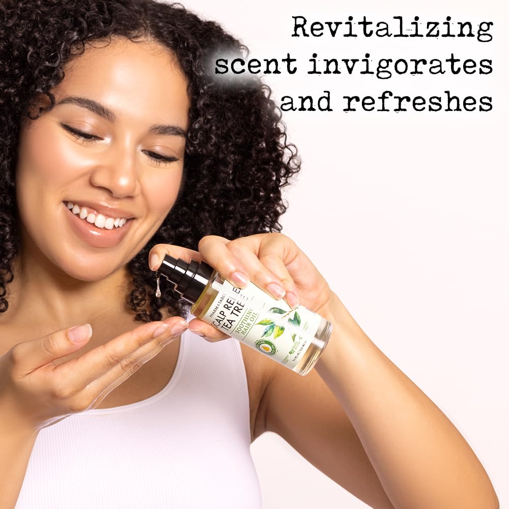 PHARM TO TABLE Tea Tree Hair Oil bottle on wet hair for shine and manageability