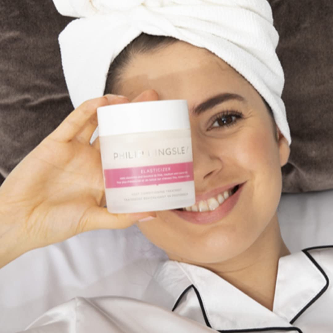 PHILIP KINGSLEY Elasticizer bottle on hair shows added shine and bounce.