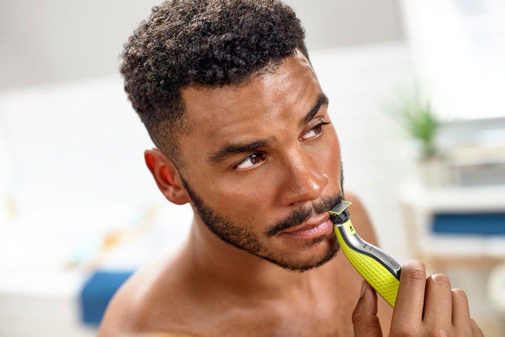 Philips Norelco OneBlade body comb enables even trims on torso