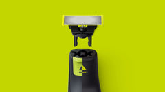 Philips OneBlade beard-trimmer-use close-up—versatile blades for facial hair.